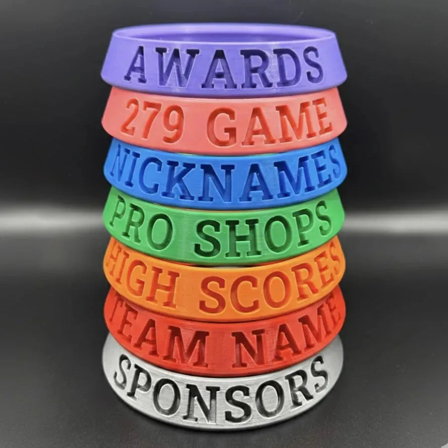 Stack of colorful rings with text on a black background