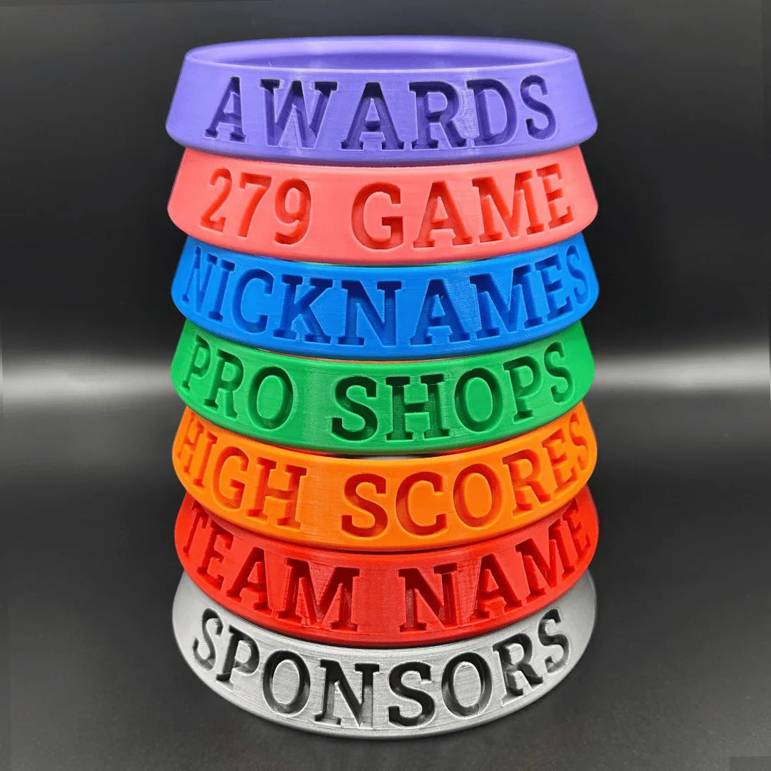 Stack of colorful rubber bands with text on a dark background