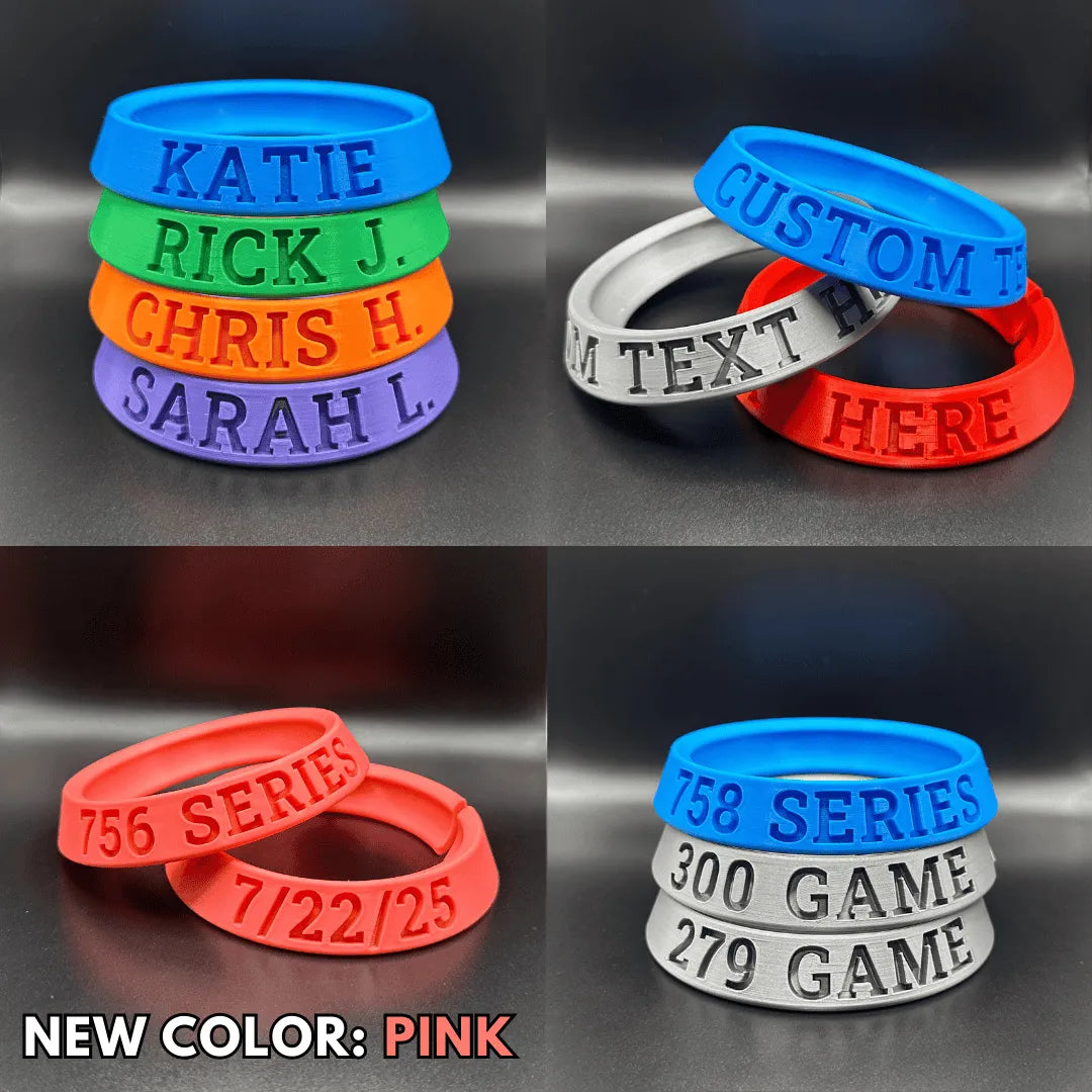 Collage of personalized silicone rings with text and numbers on a reflective surface.